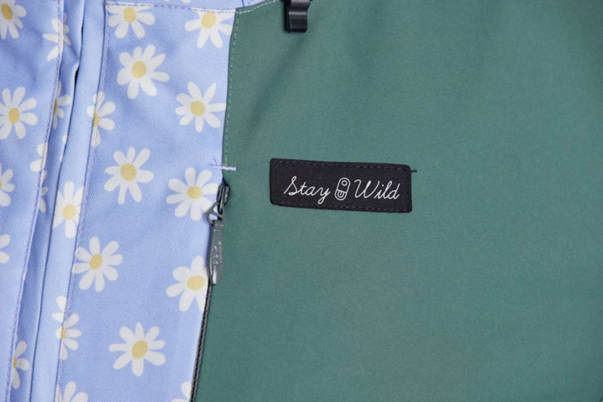 Airblaster Women's Freedom Insulated Suit 2024 - A light blue snowsuit with a repeating pattern of white flowers and yellow centers.