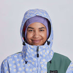 Airblaster Women's Freedom Insulated Suit 2024 - A light blue snowsuit with a daisy pattern and black accents.