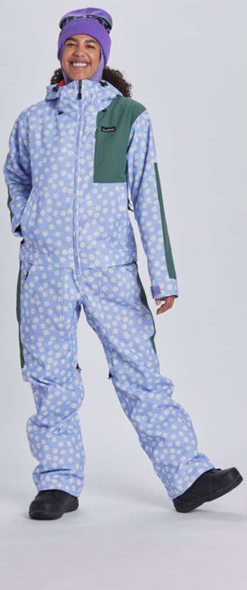 Airblaster Women's Freedom Insulated Suit 2024 - A light blue snowsuit with a white floral pattern and green accents on the shoulders, chest, and side panels.