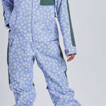 Airblaster Women's Freedom Insulated Suit 2024 - A light blue snowsuit with a white floral pattern and green accents on the shoulders, chest, and side panels.
