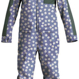 Airblaster Women's Freedom Insulated Suit 2024 - A blue snowsuit with a repeating pattern of white flowers and green accents, featuring a hood and black zippers.