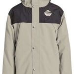 Airblaster Guide Shell Jacket 2024 - A tan-colored jacket with a black chest panel and hood, featuring a logo on the left side of the chest.