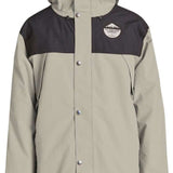 Airblaster Guide Shell Jacket 2024 - A tan-colored jacket with a black chest panel and hood, featuring a logo on the left side of the chest.