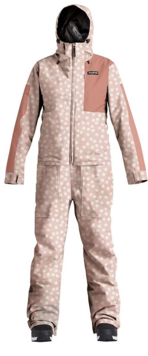 Airblaster Women's Freedom Stretch Suit 2024 - A pink snowsuit with a white pattern of small flowers and stars, featuring a black zipper on the chest.