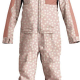 Airblaster Women's Freedom Stretch Suit 2024 - A pink snowsuit with a white pattern of small flowers and stars, featuring a black zipper on the chest.
