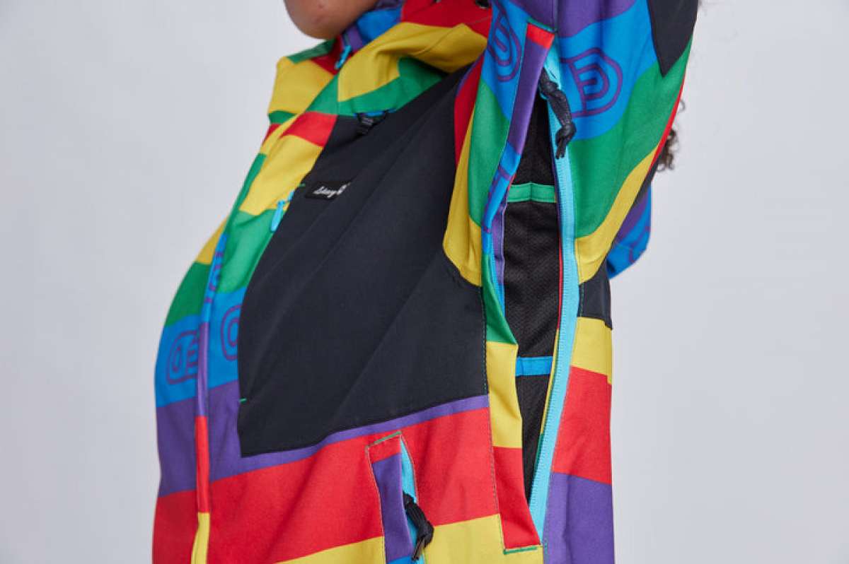 Airblaster Women's Freedom Stretch Suit 2024 - A black, red, yellow, green, and purple suit with a geometric pattern.