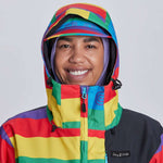 Airblaster Women's Freedom Stretch Suit 2024 - A woman wearing a black, purple, and pink suit with a geometric pattern on the arms and legs.