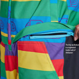 Airblaster Women's Freedom Stretch Suit 2024 - A woman wearing a multicolored, rainbow-striped snowsuit with purple accents and a black strap across her chest.