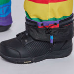 Airblaster Women's Freedom Stretch Suit 2024 - A black, high-top boot with a textured pattern on the side and a purple tag hanging from the laces.