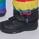 Airblaster Women's Freedom Stretch Suit 2024 - A black, high-top boot with a textured pattern on the side and a purple tag hanging from the laces.