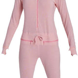Airblaster Women's Merino Ninja Suit 2024 - A pink snowsuit with a hood and zipper down the front, featuring a star logo on the left chest area.