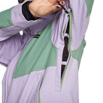 Airblaster Women's Stretch Freedom Suit 2023 - A lavender-colored snowsuit with a black zipper and green accents on the shoulders.