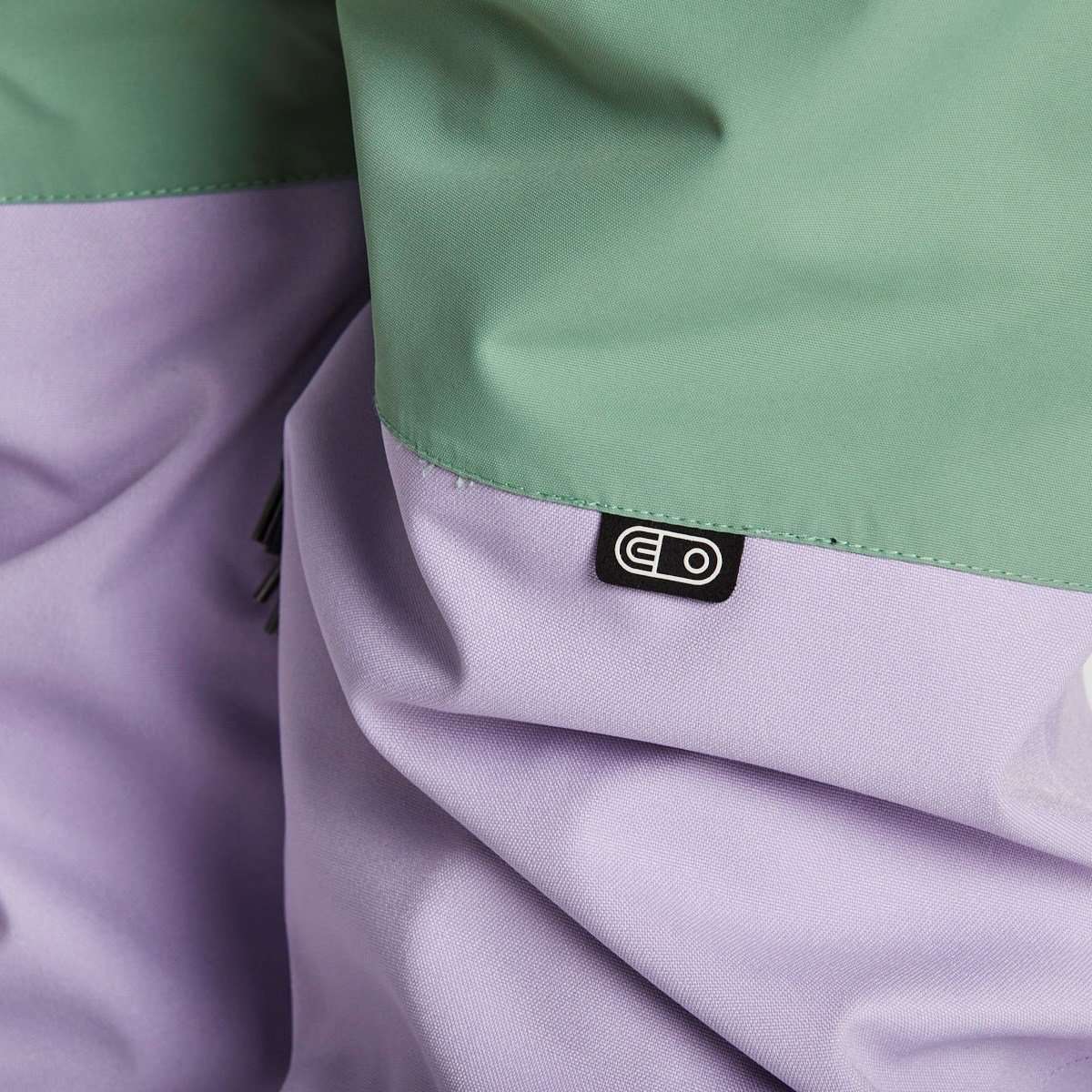 Airblaster Women's Stretch Freedom Suit 2023 - A black and white snowboard suit with a bold, geometric pattern on the pants.