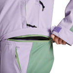 Airblaster Women's Stretch Freedom Suit 2023 - A lavender-colored snowsuit with a zipper and black drawstring on the hood.