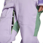 Airblaster Women's Stretch Freedom Suit 2023 - A lavender-colored snowsuit with a black zipper and white stitching on the front pocket.