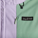 Airblaster Women's Stretch Freedom Suit 2023 - Black snowboard suit with white logo on chest and black straps on shoulders.