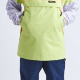 Airblaster Women's Trenchover Insulated Jacket 2022 - A black and white jacket with a hood, worn by a model posing in front of a plain background.