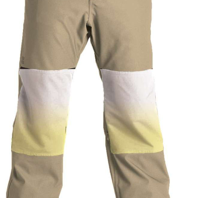 Airblaster Max Elastic Boss Pants 2023 - A pair of khaki-colored snow pants with a yellow stripe on the left thigh and white accents on the right knee.
