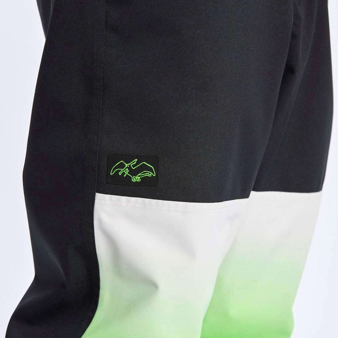 Airblaster Max Elastic Shell Boss Pant 2024 - Black pants with a neon green logo on the left thigh.