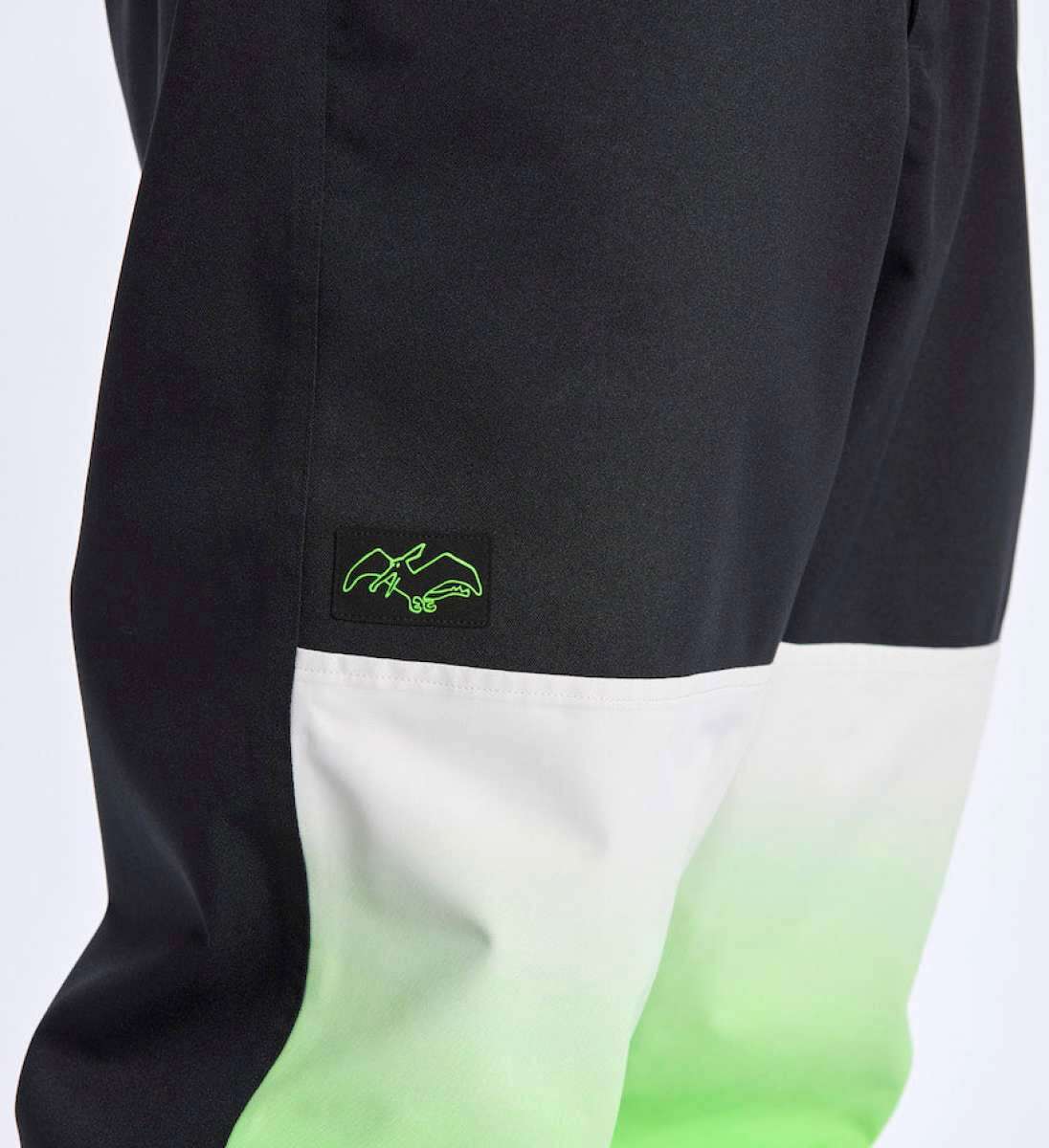 Airblaster Max Elastic Shell Boss Pant 2024 - Black pants with a neon green logo on the left thigh.