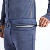 Airblaster Ninja Suit Merino 2022 - A heathered blue merino wool base layer with a zippered front and gold zipper pull.