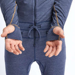 Airblaster Ninja Suit Merino 2022 - A heathered blue one-piece snowsuit with yellow stitching and a drawstring waist.