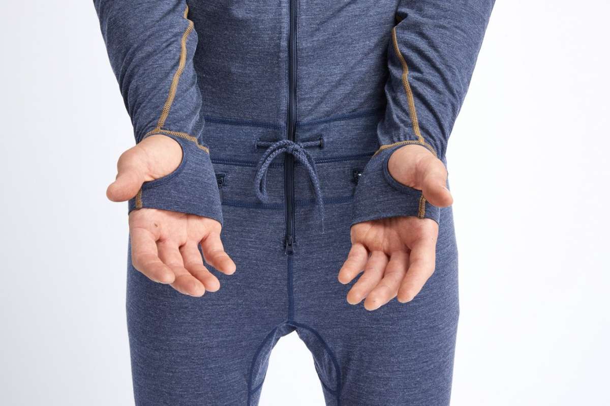 Airblaster Ninja Suit Merino 2022 - A heathered blue one-piece snowsuit with yellow stitching and a drawstring waist.