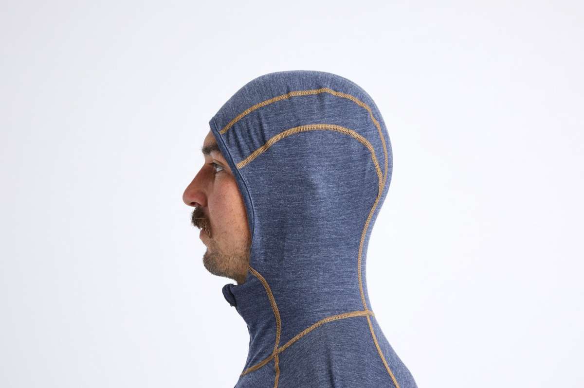 Airblaster Ninja Suit Merino 2022 - A heathered blue merino wool balaclava with tan stitching and zipper.