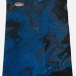 Airhole Balaclava Hinge Polar 2024 - A blue balaclava with a black marbled pattern and an oval-shaped vent on the left side of the face.