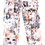 Airhole Junior Milk Fleece Thermal Set 2024 - A white fleece set with a repeating pattern of orange and grey cats in various poses.
