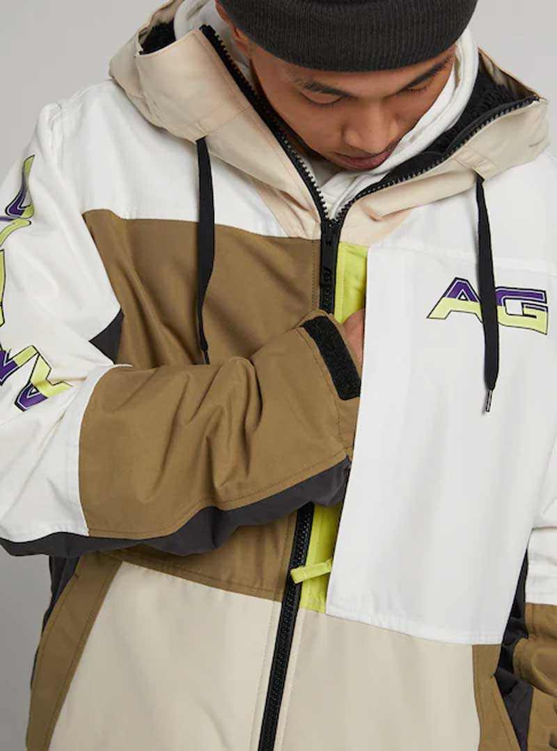 Analog Greed Jacket - A tan, white, and brown jacket with a zippered front and black drawstrings on the hood.