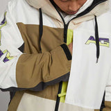 Analog Greed Jacket - A tan, white, and brown jacket with a zippered front and black drawstrings on the hood.