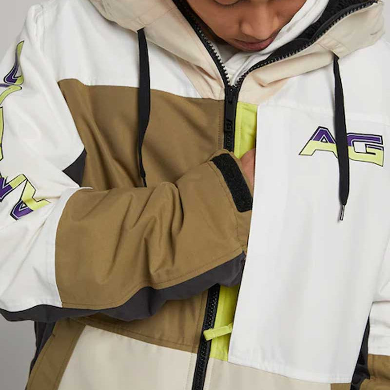 Analog Greed Jacket - A tan, white, and brown jacket with a zippered front and black drawstrings on the hood.