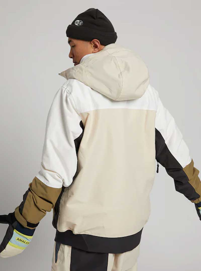 Analog Greed Jacket - A cream-colored jacket with a black stripe on the left sleeve and a brown stripe on the right sleeve.
