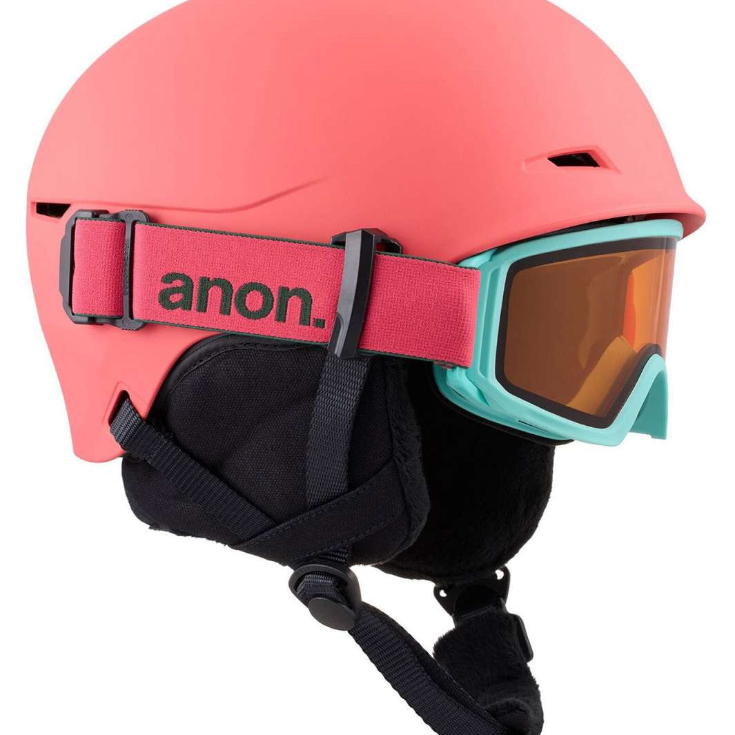 Anon Junior's Define Helmet 2024 - A coral-colored helmet with a black chin strap and ventilation holes on top.