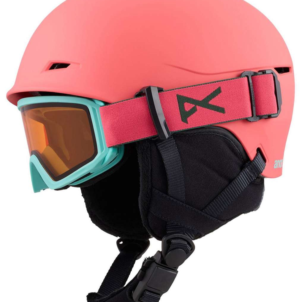 Anon Junior's Define Helmet 2024 - A coral-colored helmet with a black strap and buckle on the back.