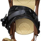 Arbor Cypress Snowboard Binding 2023 - A brown snowboard binding with a tan strap and black buckles.