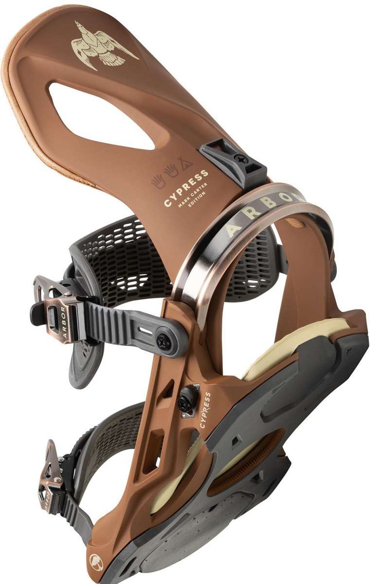 Arbor Cypress Snowboard Binding 2023 - A brown snowboard binding with a white logo on top and black buckles.