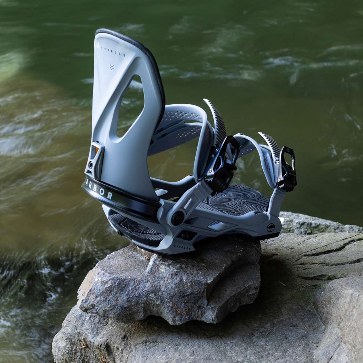 Arbor Cypress Snowboard Bindings 2024 - A pair of snowboard bindings with a sleek, modern design and silver buckles.