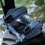 Arbor Cypress Snowboard Bindings 2024 - A pair of snowboard bindings with a sleek, modern design and silver buckles.