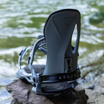 Arbor Cypress Snowboard Bindings 2024 - A pair of snowboard bindings with a sleek, modern design and silver buckles.