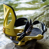 Arbor Cypress Snowboard Bindings 2024 - Yellow bindings with black straps and buckles, featuring a textured pattern on the baseplate.