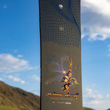 Arbor Draft Camber Snowboard 2024 - A black snowboard with a white logo and blue lines on top.