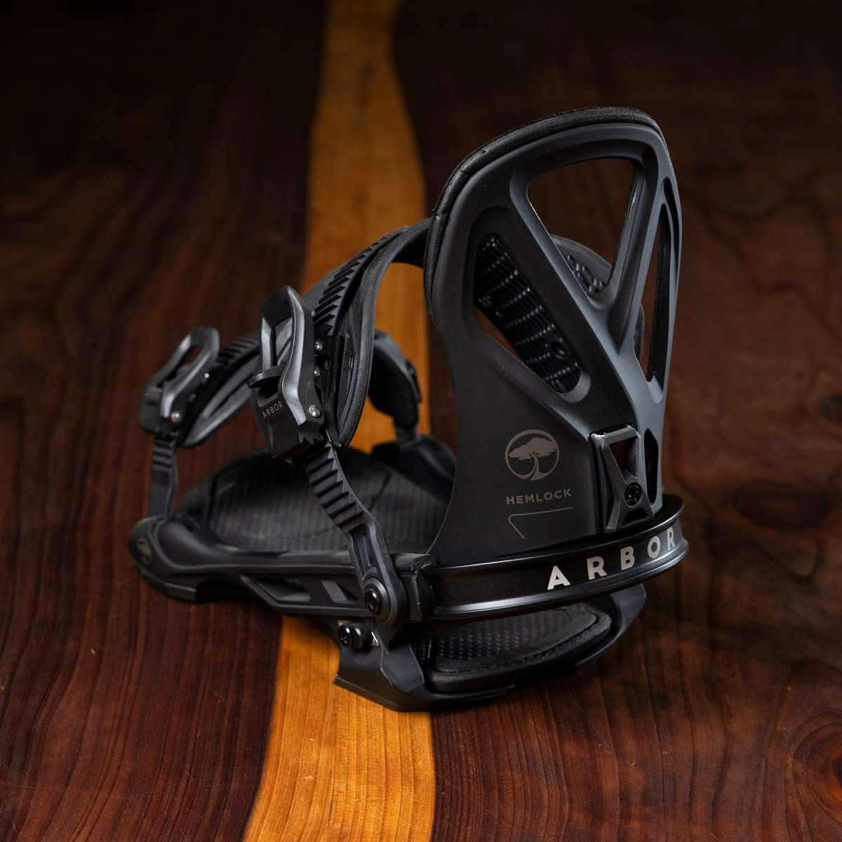 Arbor Hemlock Snowboard Bindings 2023 - Black bindings with a minimalist design, featuring a sleek black strap and a subtle logo on the side.