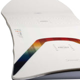 Arbor Women's Poparazzi Rocker Snowboard 2023 - A white snowboard with a rainbow-colored stripe along its edge.