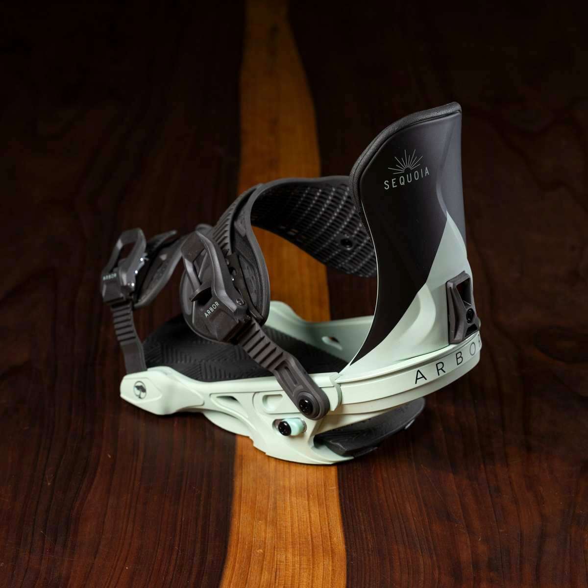 Arbor Women's Sequoia Snowboard Bindings 2023 - Black bindings with white accents and a sunburst logo on top of the ankle strap.