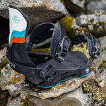 Arbor Women's Sequoia Snowboard Bindings 2024 - A black snowboard binding with a white, blue and orange graphic on the strap.