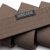 Arcade Ranger Belt 2023 - Brown belt with a repeating geometric pattern of small triangles in lighter brown, on a textured woven fabric.