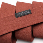 Arcade Ranger Belt 2023 - Brown belt with a repeating pattern of small, dark brown triangles on a light brown background.
