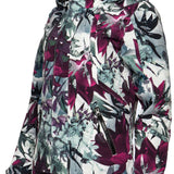 Arctix Women's Blizzard Insulated Jacket - A white jacket with a floral pattern of purple and green flowers, featuring a hood and zipper down the front.